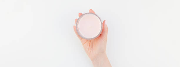 istock Woman hand with pink candle 1035487526