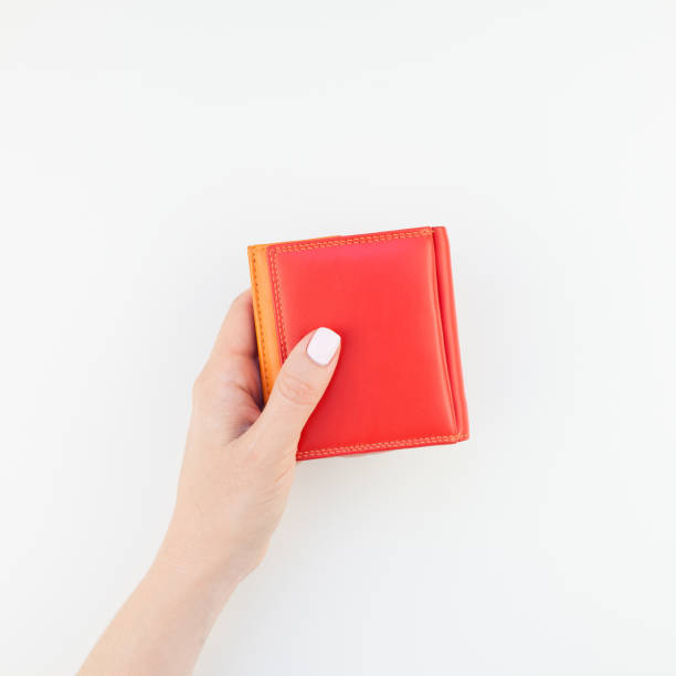 istock Woman hand with red wallet isolated 1035488672