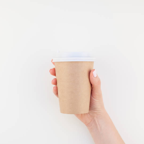 istock Mock up of coffee cup in female hand 1035488876