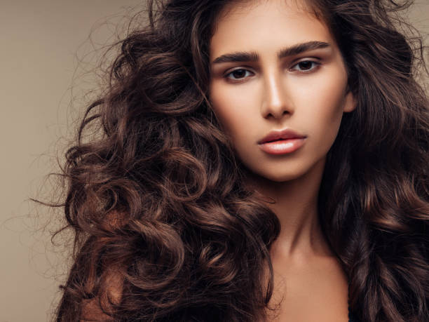 istock Beautiful girl with lush curly hairstyle 1035491002