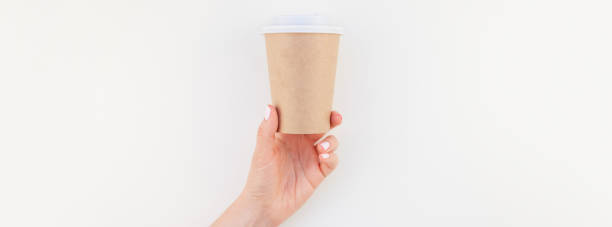 istock Mock up of coffee cup in female hand 1035491552