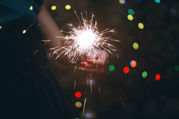 istock girl holds bengal lights 1035493640