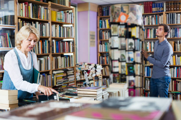 istock Woman searching for new book 1035495854