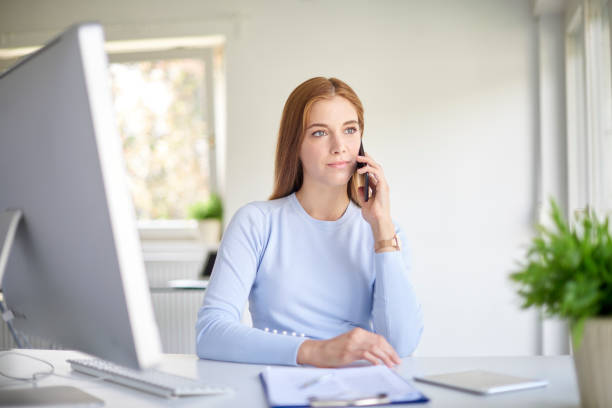 istock Businesswoman using her cell phone 1035496438