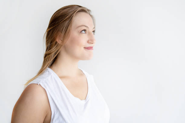 istock Beautiful young woman looking away 1035496486