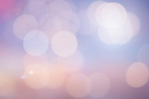 istock blurred beautiful natural pastel background lens ray flare flash light with double exposure of bokeh light 1035497440