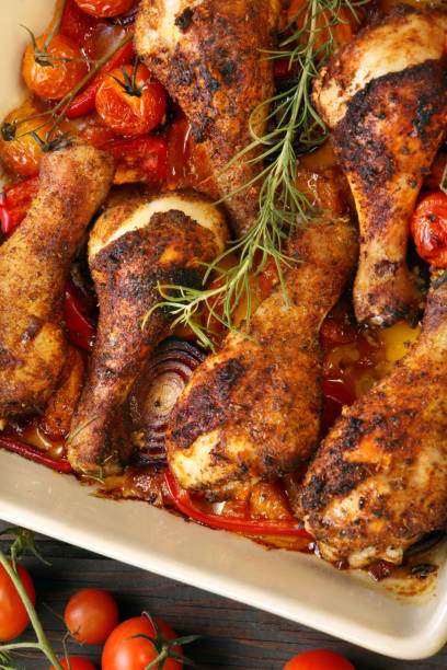 istock Roasted chicken legs on the ceramic bowl cooked with vegetables 1035504430