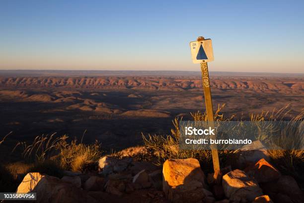 A Sign At The Top Of Mount Sonder Shows The Kilometres Back To Alice Springs Stock Photo - Download Image Now