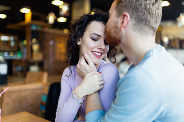istock Young couple on date in coffee shop 1035508492