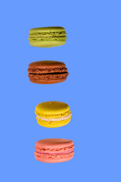 istock Stack of the french macaroons isolated on a blue background 1035511932