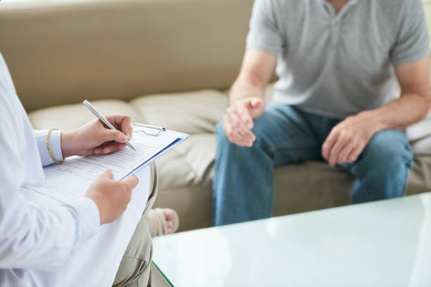istock Crop doctor writing down complaints of patient 1035512732