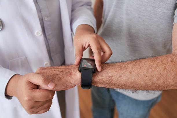 istock Crop doctor and patient using smart watch 1035512830