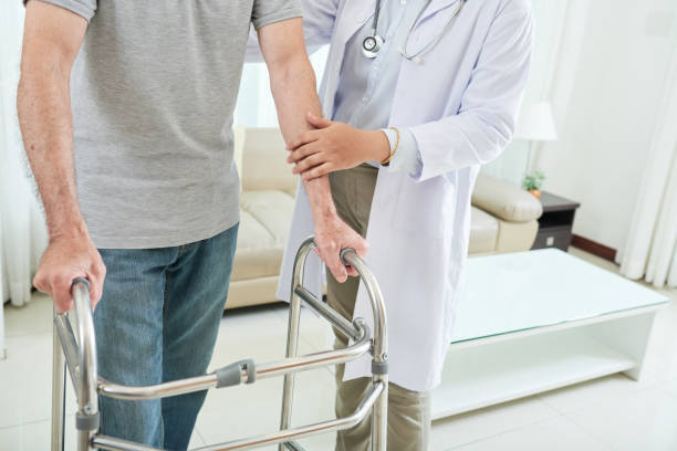 istock Crop man with walker and doctor 1035512846