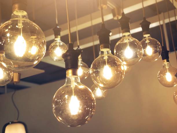 istock Light bulbs decoration in cafe shop, new ideas concept, thinking innovation, business solutions 1035513070