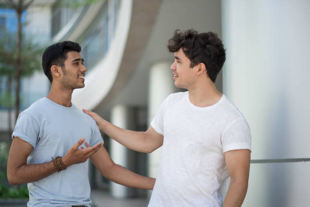 istock Positive handsome friends sharing life story 1035518520