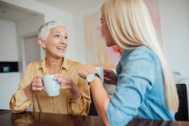 istock Mother and daughter talking and drinking coffe 1035518590