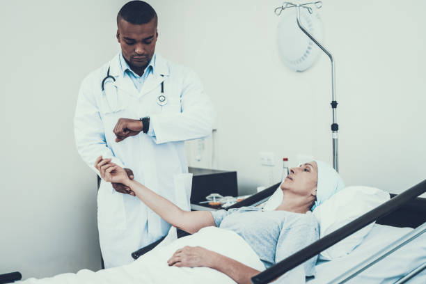istock Doctor Measuring Pulse. Patient on Rehabilitation. 1035519384