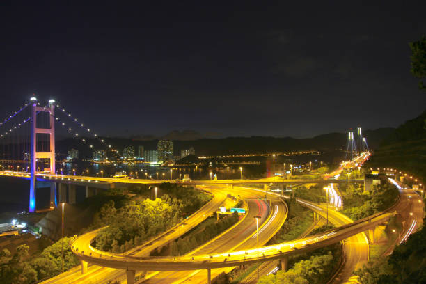 istock the highway bridge at day in hong kong at night 1035526414