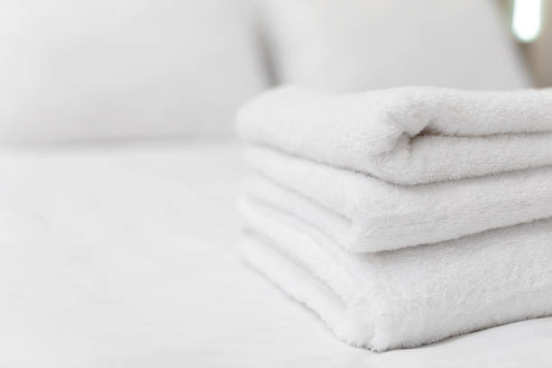istock Clean towels on bed at hotel room 1035526520