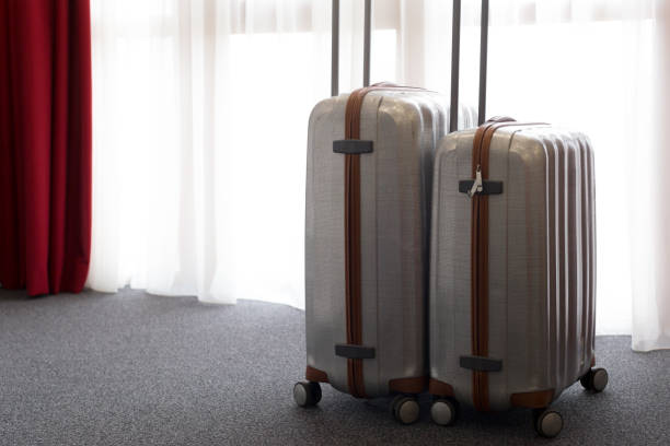 istock Suitcase or luggage bag in a modern hotel room 1035527220