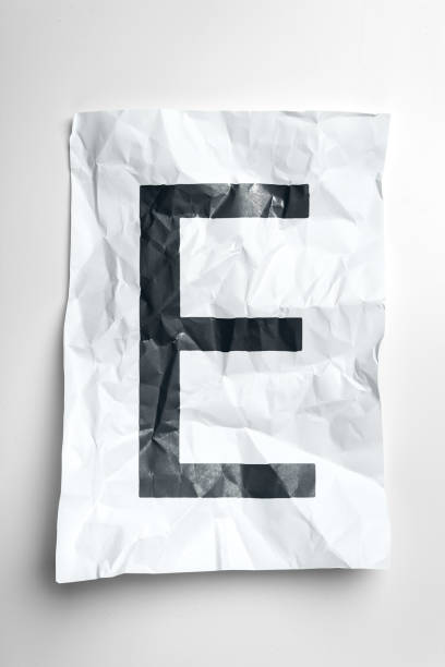 istock Grunge wrinkled paper letters on white background 1035527428