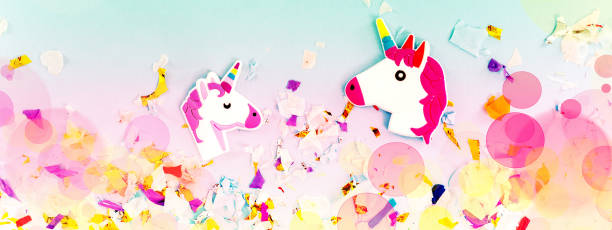 istock A white unicorn with rainbow horn and confetti top view. 1035527714