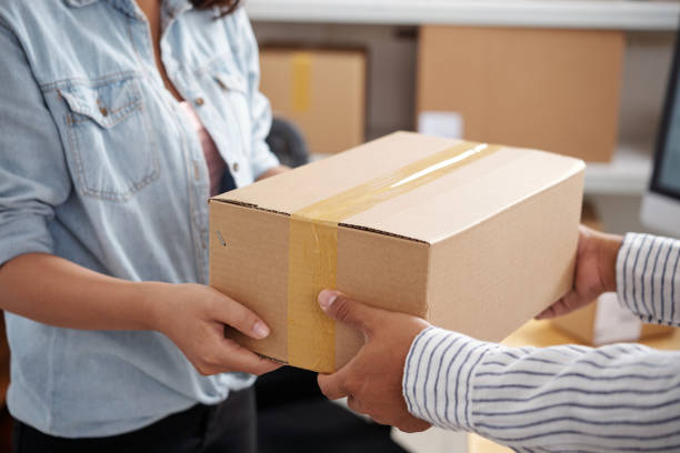 istock Woman receiving parcel 1035529992