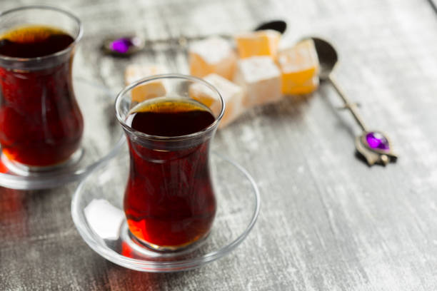 istock Red tea in turkish glasses on a wooden table 1035530348