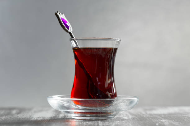istock Red tea in turkish glasses on a wooden table 1035531076