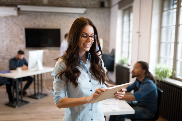 istock Young beautiful architect holding tablet in office 1035534918
