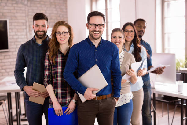 istock Group of successful young architects posing in office 1035535226