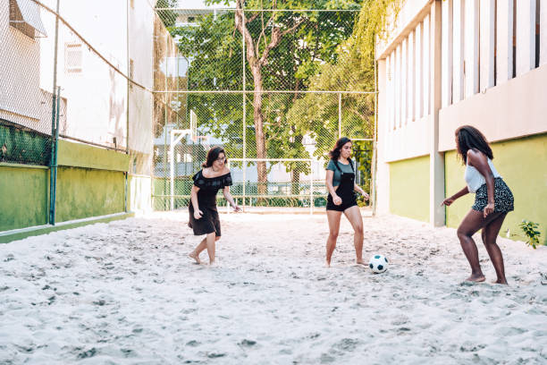 istock Young female friends playing soccer 1035539668