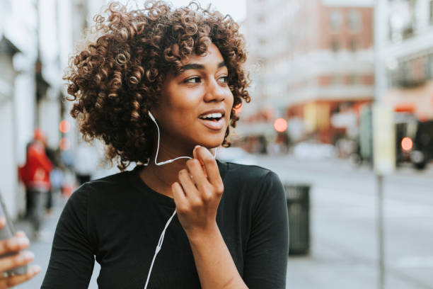 Cheerful woman talking through a headset Cheerful woman talking through a headset lifestyle people stock pictures, royalty-free photos & images