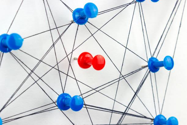 istock red needle between blue needles, connected together by a thread, symbol of communication between objects that ignore one object 1035549240