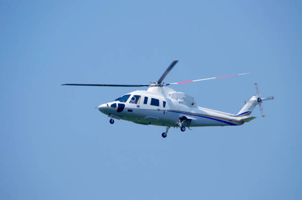 istock helicopter flies in the sky 1035549794