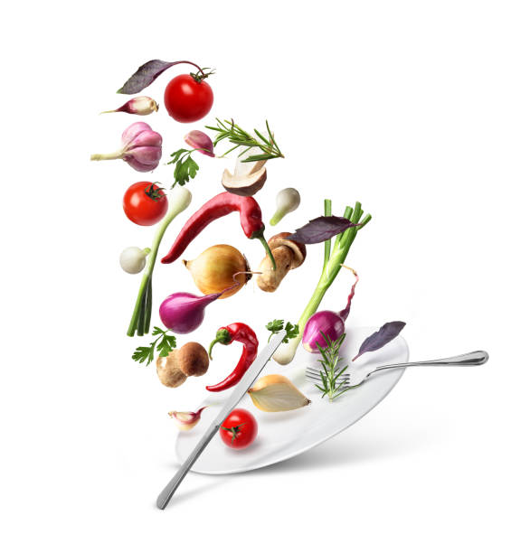 istock Vegetables in the air with a plate on a white background.Eda.Dieta 1035551480