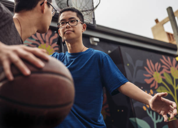 istock Twins at basketball 1035553812
