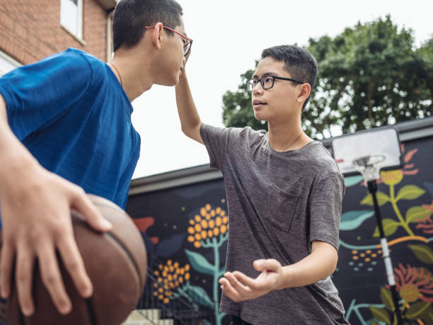 istock Twins at basketball 1035553914