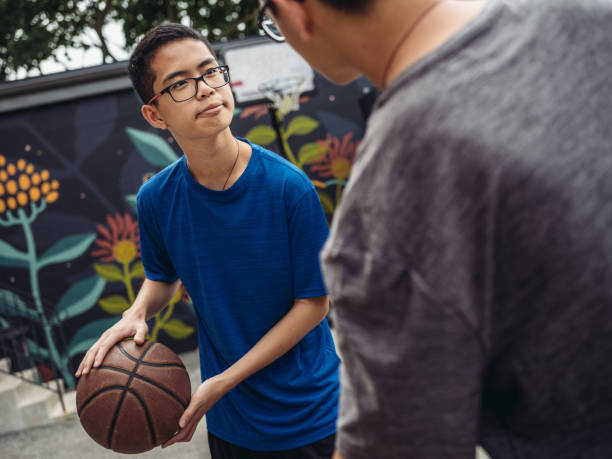 istock Twins at basketball 1035554414