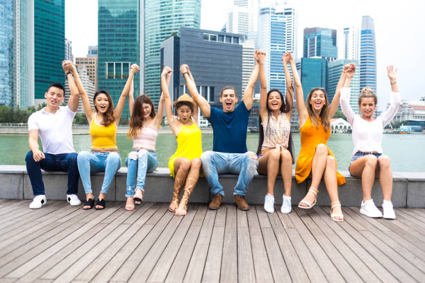istock Friends having fun on street, hands raised 1035560698