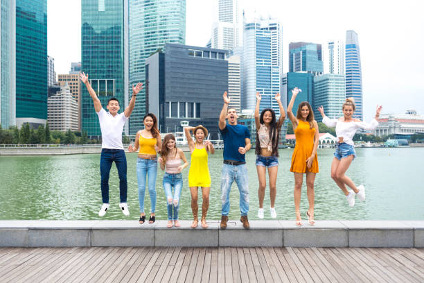istock Friends having fun and jumping on street 1035560704