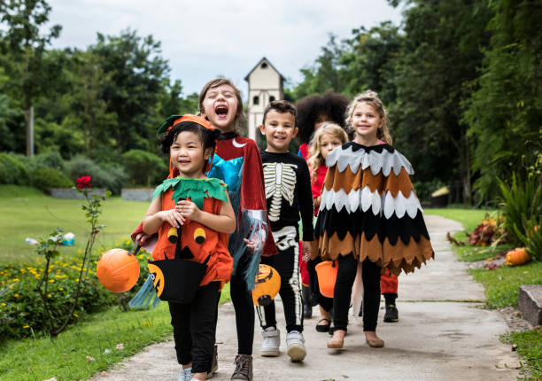 istock Young kids trick or treating during Halloween 1035561078