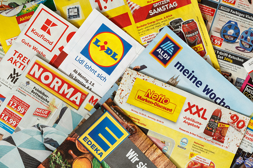 Amberg, Germany - September 3, 2018: Advertising leaflets of some German supermarket chains. Logos and brands are visible. Lidl, Aldi Süd, Norma, Netto,Kaufland,EDEKA
