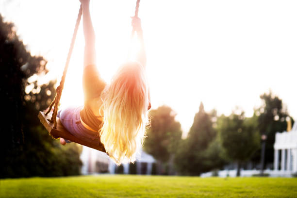 istock Young Woman Swinging 1035570186