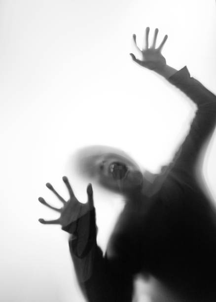 istock A boy trapping behind frosted glass 1035588384