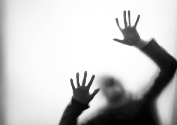 istock A boy trapping behind frosted glass 1035590872