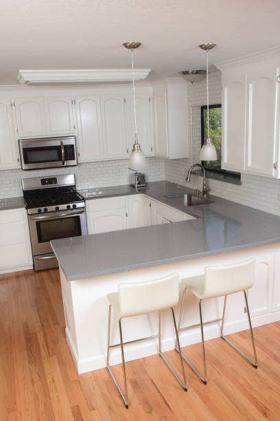 istock Classic White Domestic Kitchen with Subway Tile and Quartz Counters 1035592498