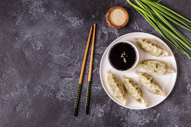 Asian dumplings, soy sauce, chopsticks Asian dumplings, soy sauce, chopsticks. Top view, copy space. chinese dumpling photos stock pictures, royalty-free photos & images