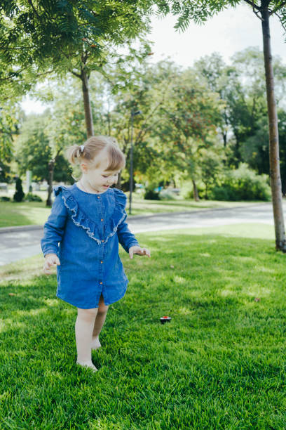 istock Little girl walking in a park 1035592692