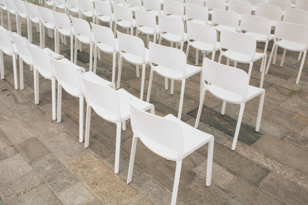 istock a lot of white empty chairs in a row 1035600262